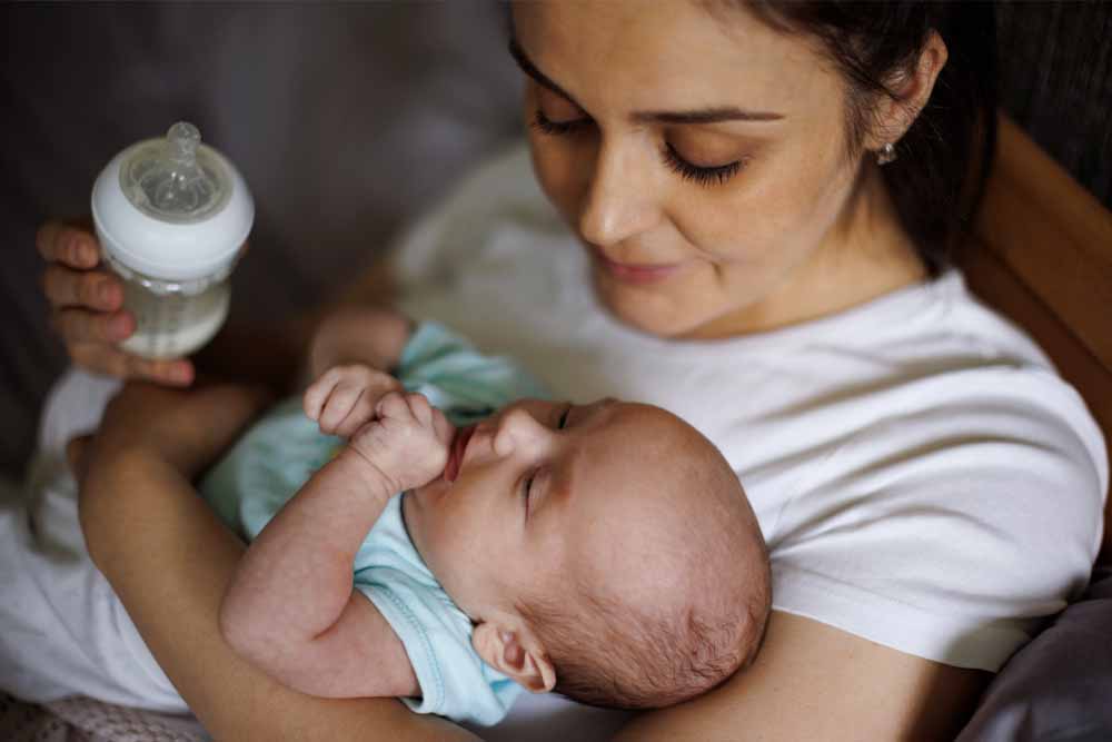 Mother feeding baby Mother feeding baby